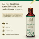 Goutte d’Holly Bach prête à être appliquée sous langue pour un équilibre émotionnel.
