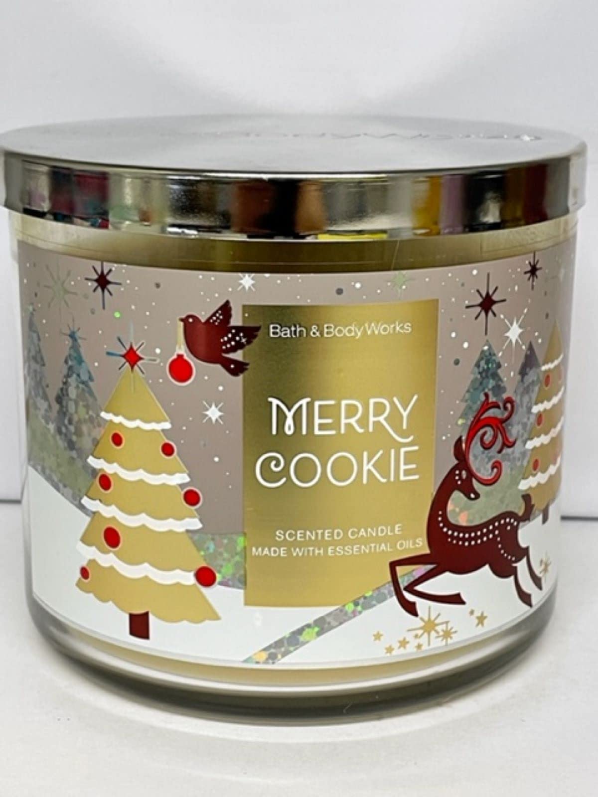 Bath & Body Works Merry Cookie, bougie 3 mèches, étiquette variable, parfum réconfortant pour espace cosy.