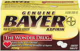 Tablettes Bayer Aspirine 325 mg en gros plan, forme et texture visibles