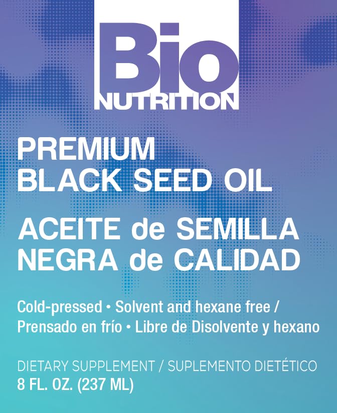 Bio Nutrition huile nigelle: versement facile sur cuillère pour dosage précis.