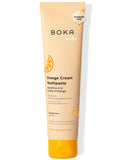 Pâte dentifrice Boka Orange Crème dans emballage, idéale pour la routine quotidienne des enfants.