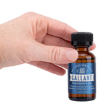 Huile Bourbon Royalty près d’un diffuseur pour créer une ambiance raffinée.