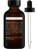 Brooklyn Botany Huile Pamplemousse — pipette ambrée pour dosage précis.