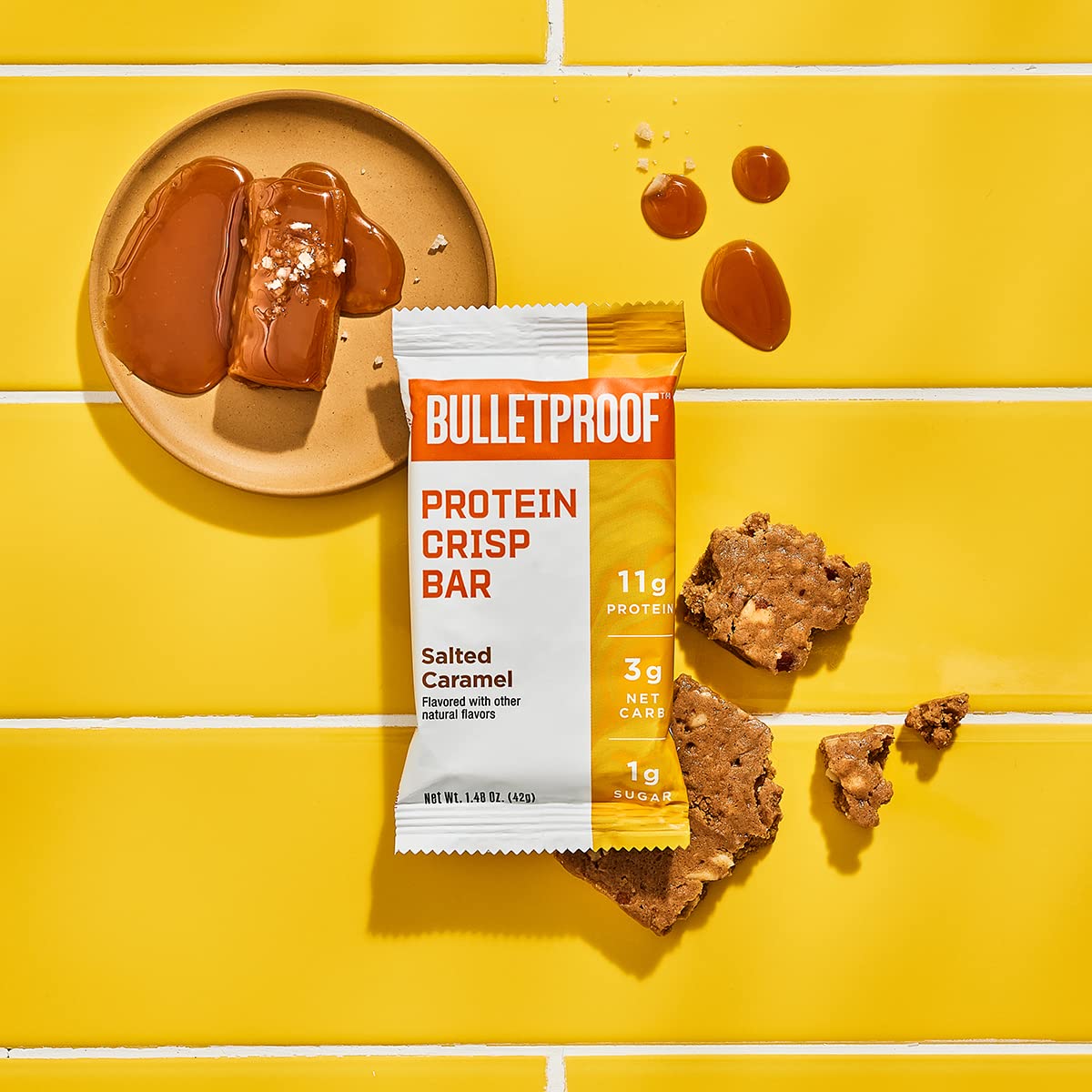 Barres Bulletproof Protein Crisp noix coco chocolat, texture gourmande et nourrissante.