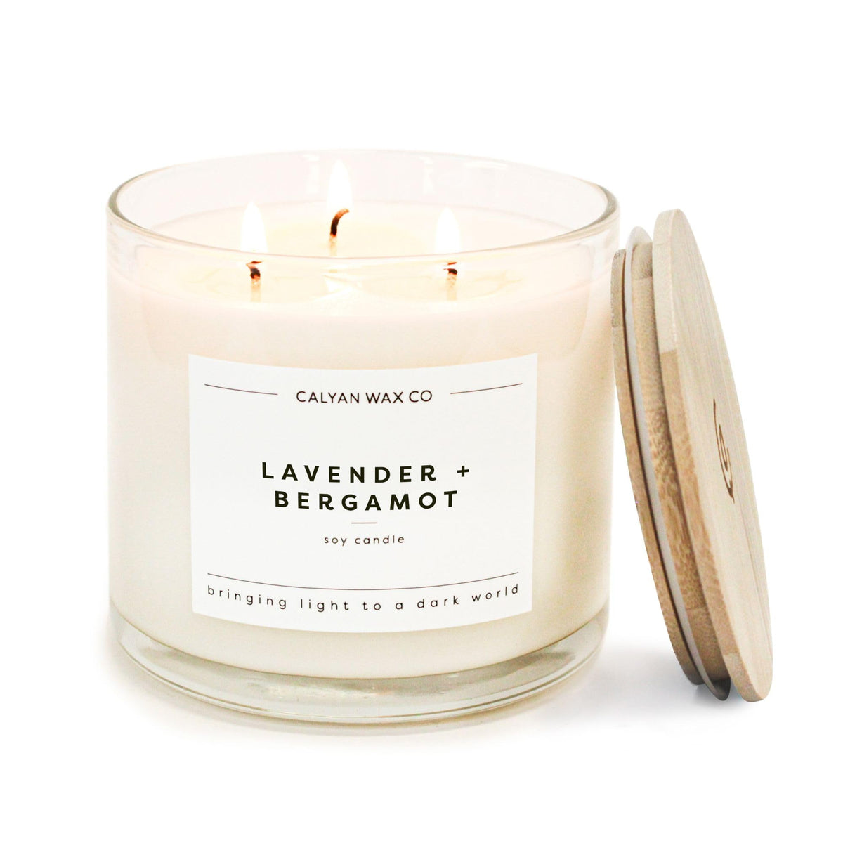 Bougie Calyan Wax Co Lavande et Bergamot, trois mèches, verre clair pour lumière douce