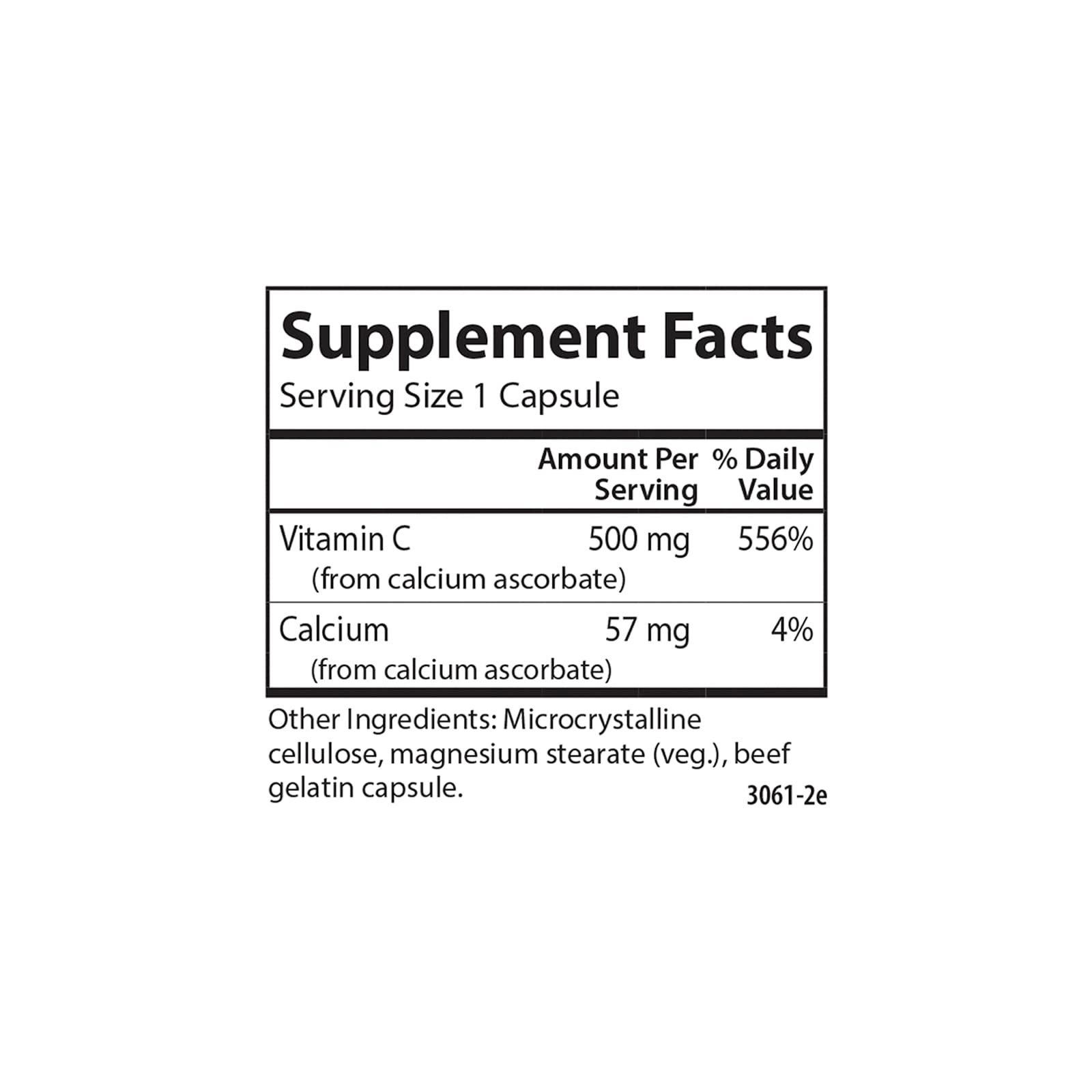 Carlson Mild-C 500 mg, bouteille près d'un verre d'eau.