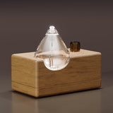 CHEZARTEMIS Waterdrop: diffuseur en verre avec socle bois, pour une ambiance apaisante.