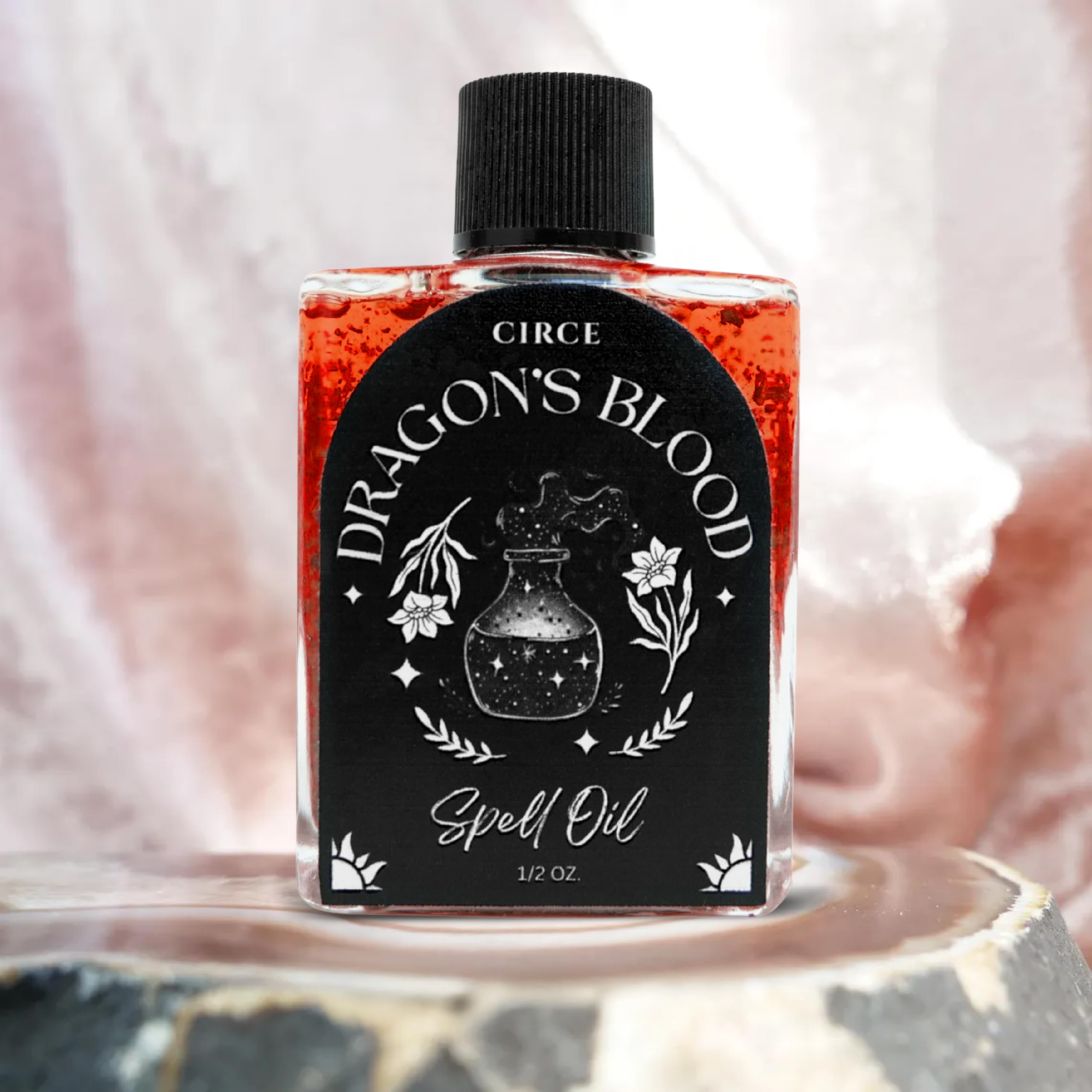 CIRCE Huile Sang de Dragon — touches sur objets personnels pour concentration et clarté.