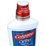 Colgate Phos-Flur: utilisateur portant des bagues orthodontiques pour une protection ciblée.