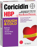 Tablettes Coricidin HBP dans la main, prête à être prise rapidement.
