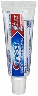 Dentifrice Crest Cavité Regular menthe douce, texture légère après brossage.