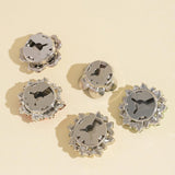 Cache-bouton Crystal Set noir, design polyvalent pour toutes les occasions.