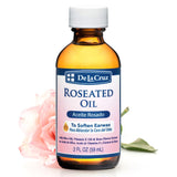Huile roseatee De La Cruz, bouteille ambree, entretien doux des oreilles.