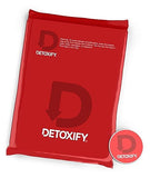 Detoxify Xxtra Clean étiquette lisible sur la bouteille et ingrédients naturels.