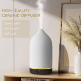 Diffuserlove diffuseur céramique, base bois grain, salon calme et atmosphère cosy.