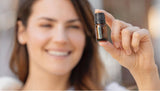 Massage avec huile de poivre noir doTERRA et huile porteuse pour chaleur réconfortante