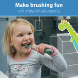 Brosse dinosaure vert-orange Dr. Brown's avec prise en main ergonomique.