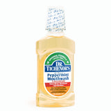 DR. TICHENOR'S Menthe Concentré – mélange eau et concentré dans un verre.