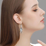 Dreuyet boucle dentaire minuscule plaqué argent, allure moderne et portable.