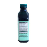Goutte Essiac dans verre — utilisation simple et absorption potentielle.