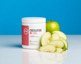 Poudre pomme-verte Fenix Nutrition L-Arginine Complete se dissolvant dans l'eau.