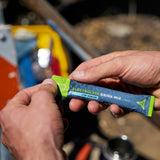 Boîte et sachets Fluid Tactical démontrant faible sucre et praticité.
