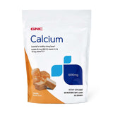 GNC Calcium 600 mg – bouchées caramel douces pour l'apport quotidien.