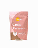 GOLDE Latte Superfood Cacao Turmeric dans une tasse chaude, réconfort sans sucre.