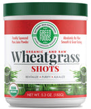 Green Foods shot d'herbe de blé : bouteille verte prête pour un coup de pouce naturel.