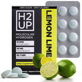 Tablettes H2UP se dissolvant dans l'eau pour une hydratation propre.