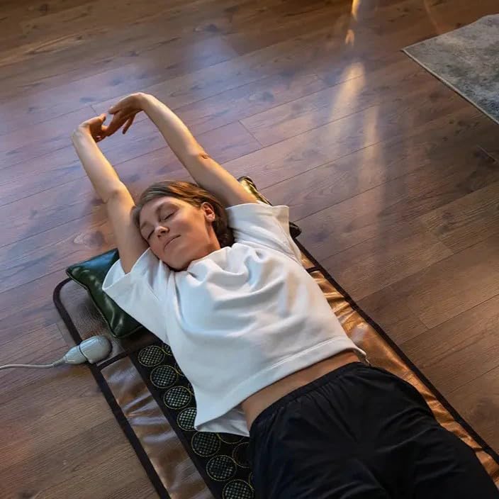 HealthyLine user applying pad on back and shoulders during routine
