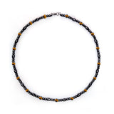 Hion collier magnétique en hématite, allure intemporelle et raffinée.