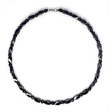 Collier Hion magnétique avec obsidienne noire et hématite, porté au quotidien pour l'ancrage.