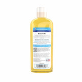 Application sur cheveux avec Hollywood Beauty Biotine Huile pour nourrir et briller.
