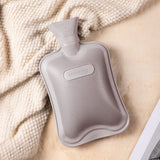 HomeTop Bouillotte Classique, chaleur ciblée pour ventre et mains lors des soirées froides.