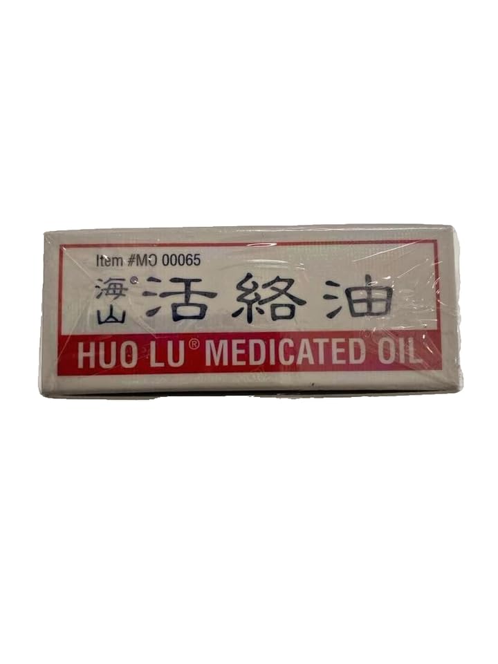 Application sur peau avec l'huile Hysan Huo Lu pour usage local.