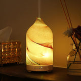 Diffuseur INRORANS en verre soufflé, décor artisanal et diffusion douce.