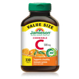 Jamieson vitamine-C 500 mg gommes orange dans la main, faciles à croquer.