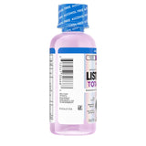 Verre doseur avec flacon Listerine Total Care pour dosage précis.