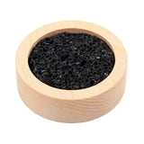 Diffuseur Lusofie en pierre de lave sur base bois, ambiance calme sur le bureau.