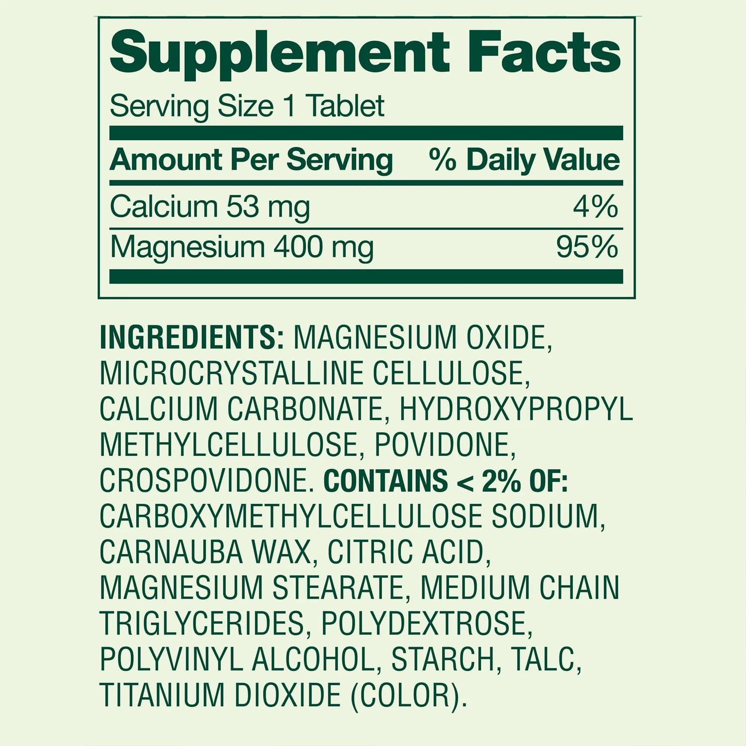 Main tenant des comprimés magnésium oxyde 400 mg pour usage nocturne.