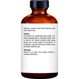 Majestic Pure Santal: flacon ambré et étiquette lisible, qualité premium.