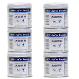 Verre d'eau et poudre Ohta's Isan pour une utilisation pratique.