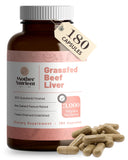 Bouteille Mother Nutrient avec capsules foie de boeuf, cadre naturel, pratique pour l'apport quotidien.