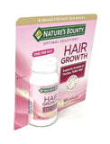 Nature's Bounty Hair Growth – capsule en premier plan pour prise journalière.