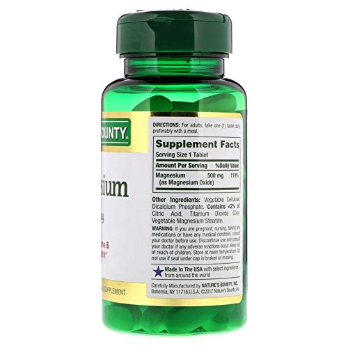 Nature's Bounty Magnesium: comprimés enrobés visibles sur planche, pratique à prendre.