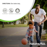 NaturesPlus Vitamine C baies d'églantier – vue rapprochée du flacon et des comprimés.