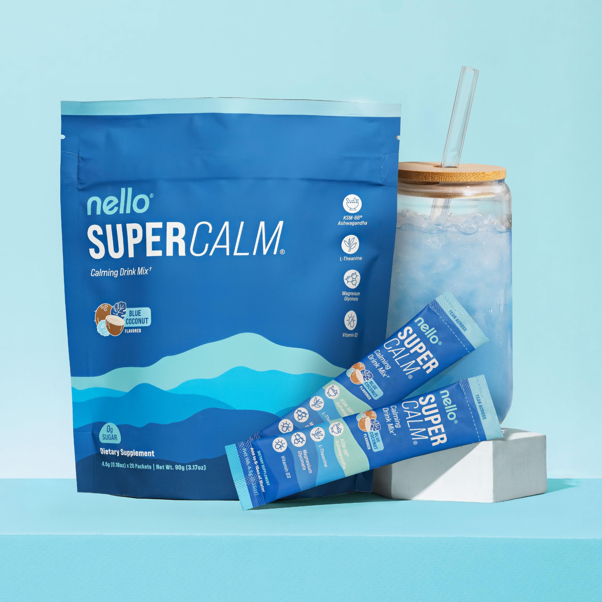 Mélange Nello SuperCalm dans un verre d'eau bleu coco, boisson apaisante