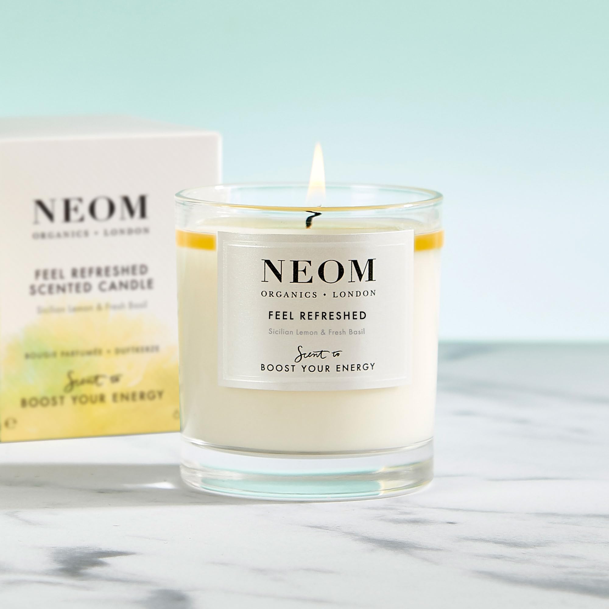 NEOM bougie, cire naturelle visible, flamme douce et durable