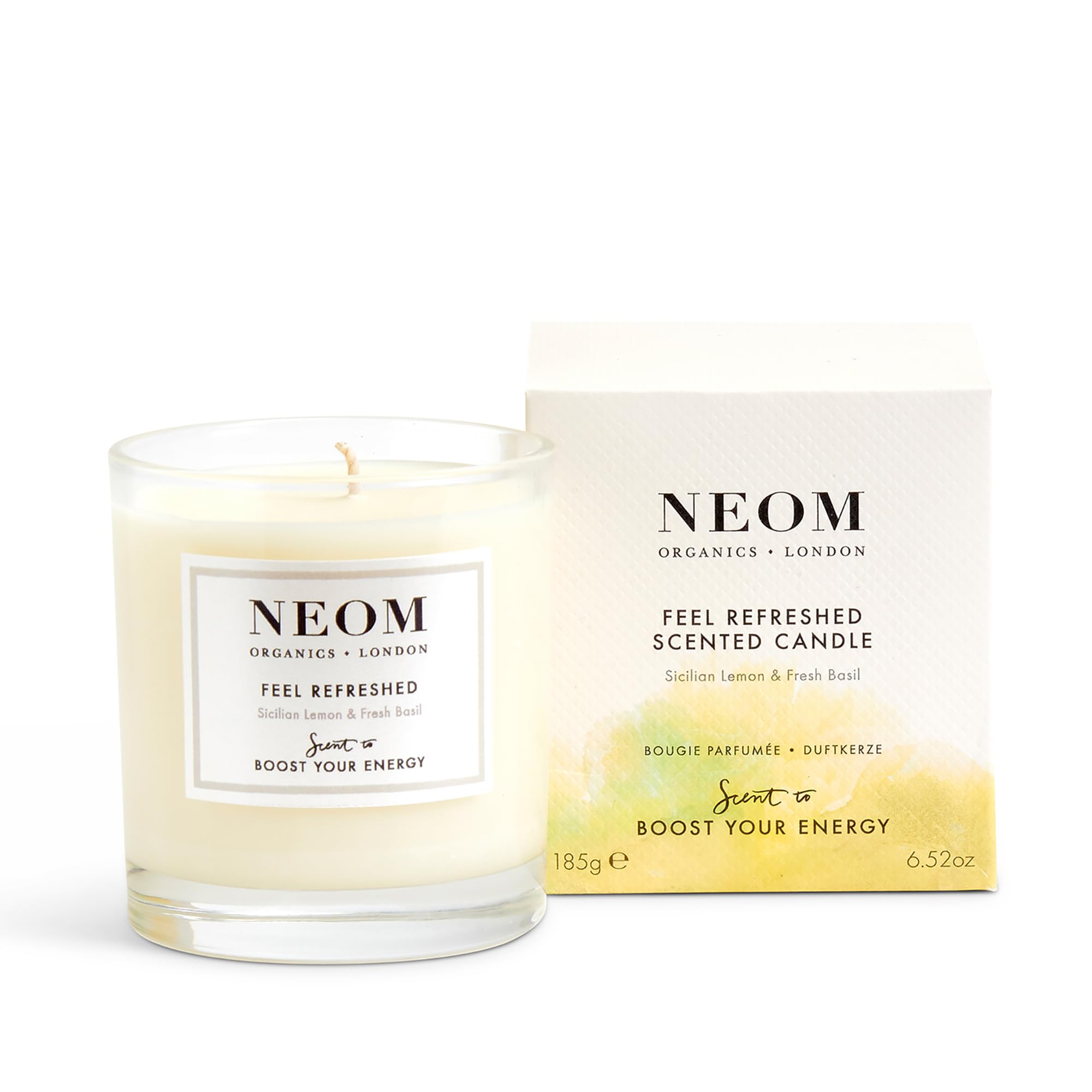 Bougie NEOM Citron-Basilic, etiquette parfumée pour énergie rafraîchissante dans une pièce